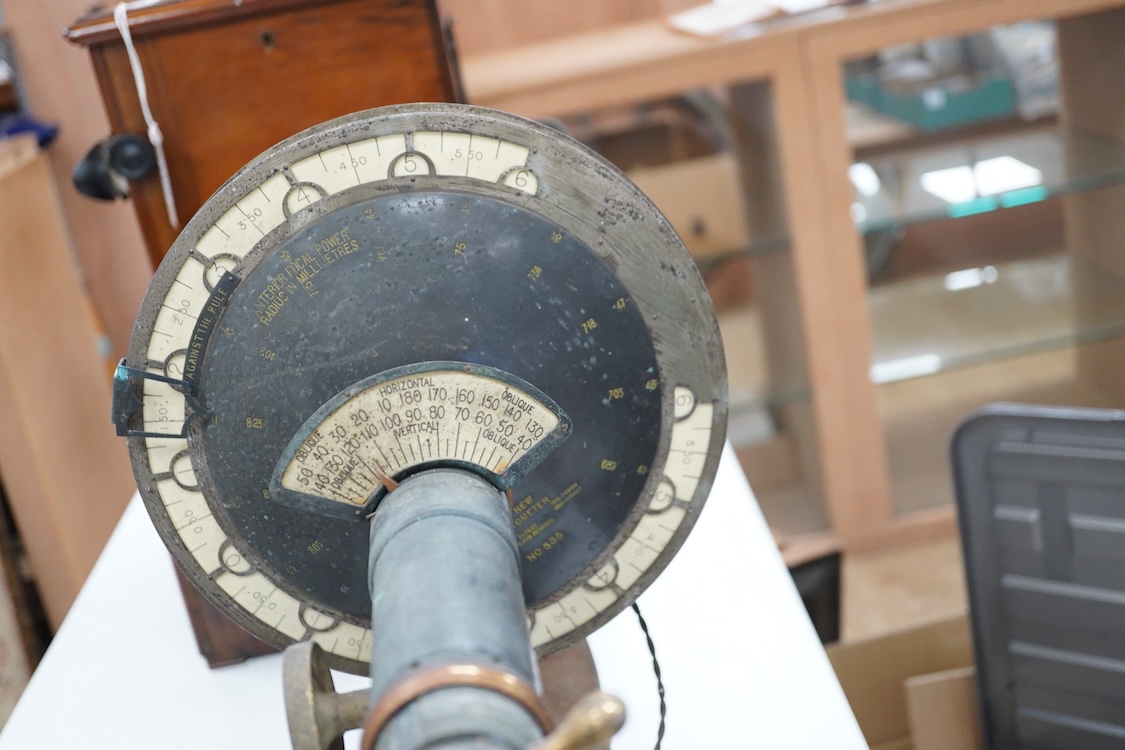 An early 20th century ophthalmic keratometer, designed to allow opticians to establish the curvature of a patient’s eye, constructed of cast-iron, brass and tin, and fitted with electric lamps and early celluloid scales,
